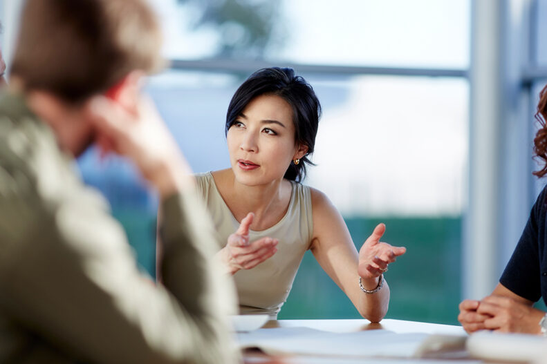 Business people talking in meeting.